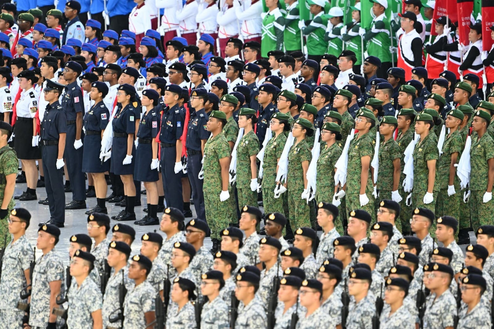 Uniformed contingents standing in formation during the NDP parade.